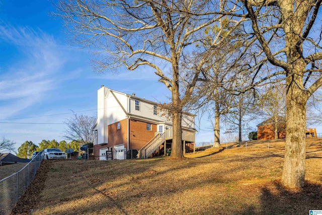 back of property featuring a lawn