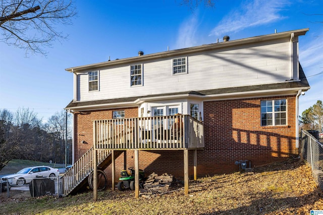 back of house featuring a wooden deck