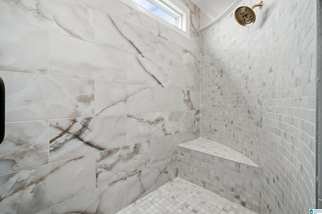 bathroom featuring tiled shower