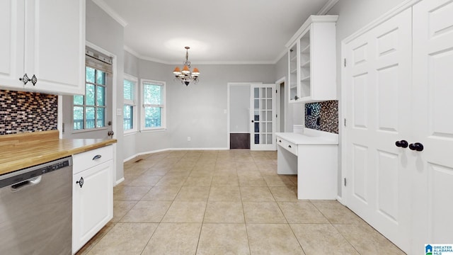 kitchen with dishwasher, light countertops, crown molding, white cabinetry, and light tile patterned flooring