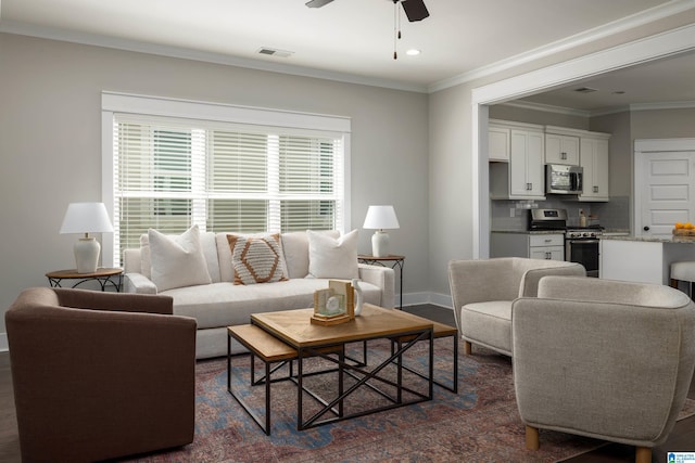 living room featuring crown molding and ceiling fan