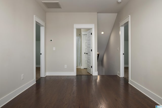 empty room with dark wood-type flooring