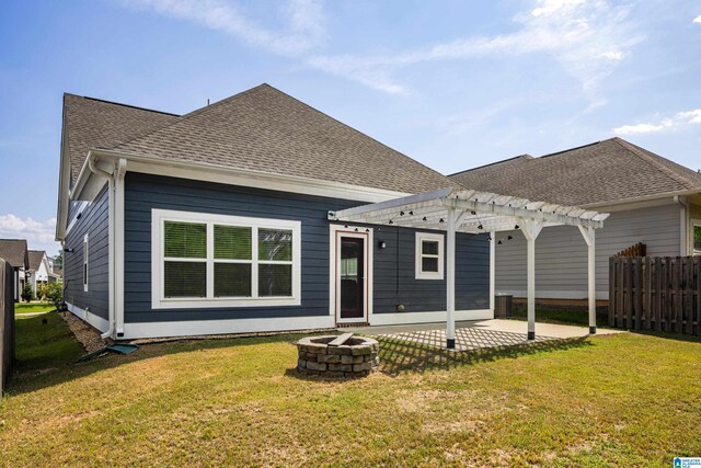 back of property featuring a pergola, a patio, a yard, and an outdoor fire pit