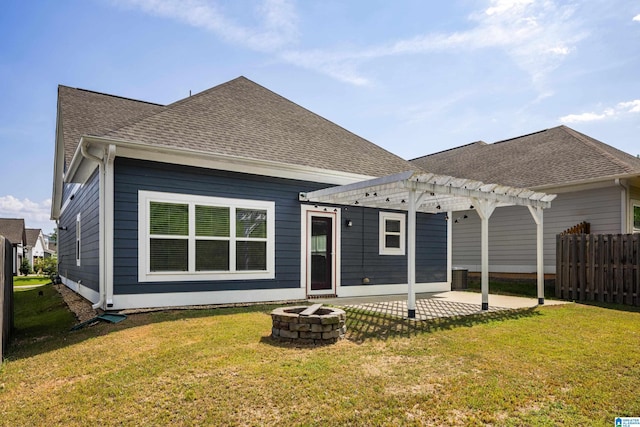 back of house featuring a fire pit, a yard, central air condition unit, and a pergola