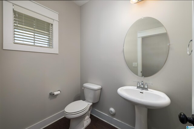 bathroom featuring toilet and hardwood / wood-style flooring