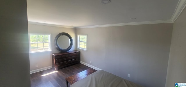 unfurnished bedroom featuring dark wood-type flooring, baseboards, and ornamental molding