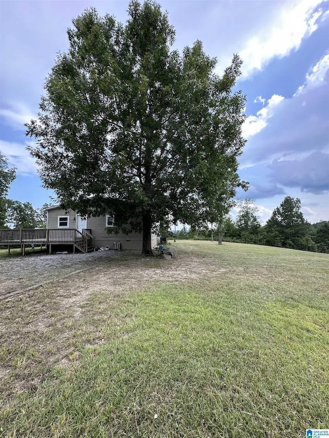 view of yard with a wooden deck