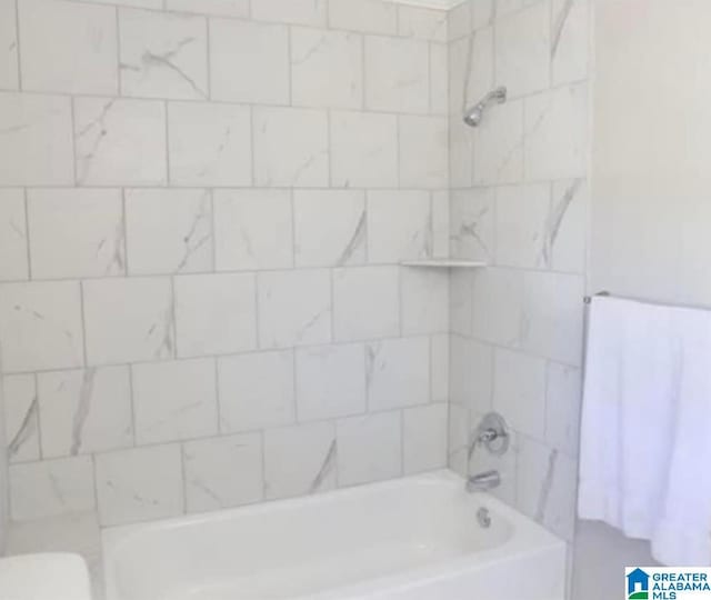 full bathroom with toilet and  shower combination