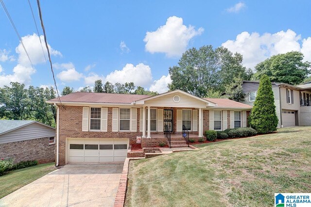 view of front of property with a garage and a front lawn