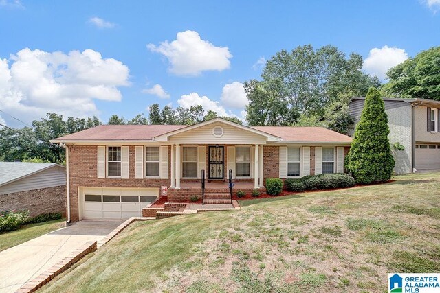 view of front facade with a garage, a front lawn, and a porch