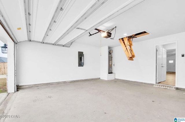 garage featuring electric panel, water heater, and a garage door opener