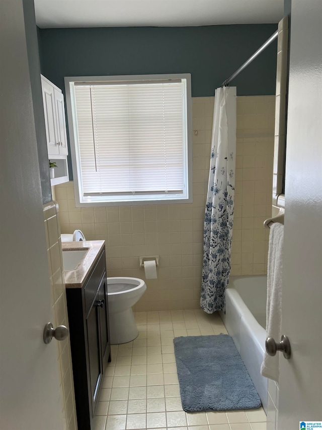 full bathroom featuring vanity, toilet, shower / bath combo, tile walls, and tile patterned flooring