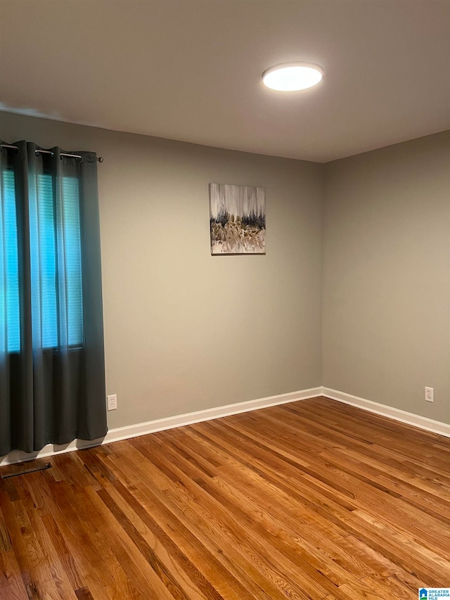 empty room featuring hardwood / wood-style floors