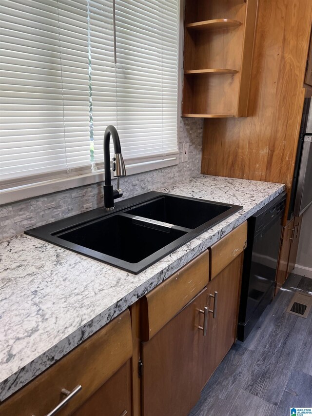 kitchen featuring tasteful backsplash, oven, dark hardwood / wood-style flooring, sink, and dishwasher