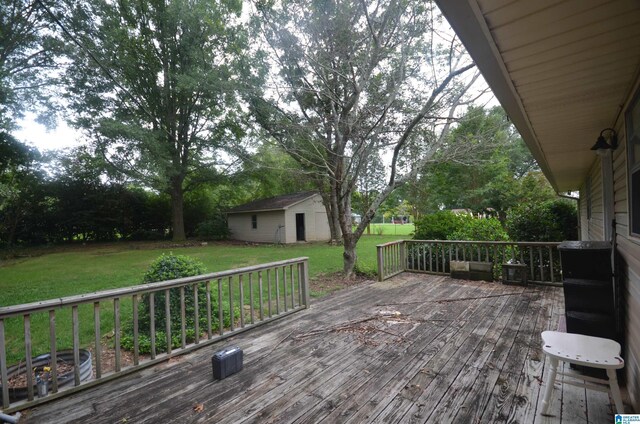 wooden deck with a lawn