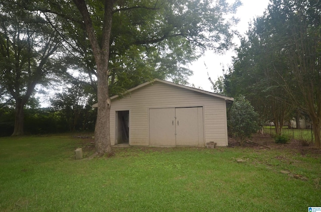 garage featuring a yard