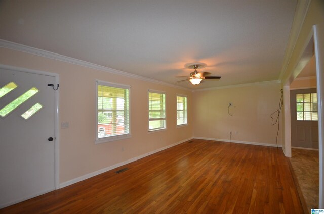 doorway to outside with wood-type flooring and crown molding