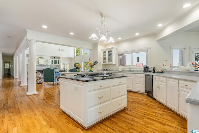 kitchen with ornate columns, black dishwasher, and white cabinets