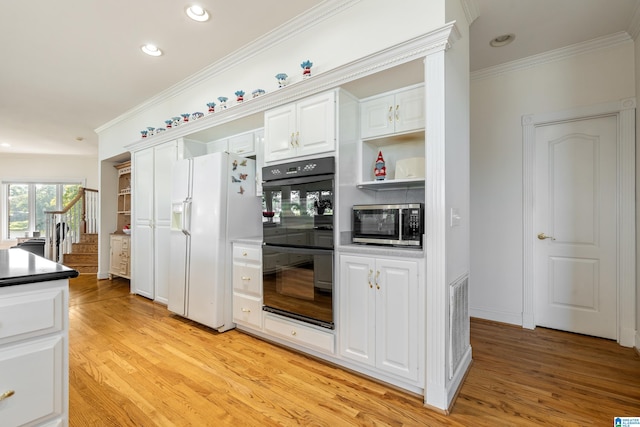 kitchen featuring white cabinetry, black double oven, white fridge with ice dispenser, crown molding, and light hardwood / wood-style flooring