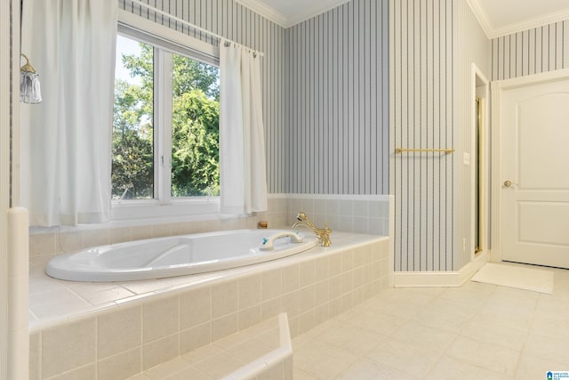 bathroom with a relaxing tiled tub and ornamental molding