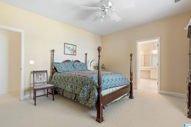 bedroom with ensuite bath, ceiling fan, and carpet