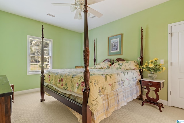 bedroom featuring light carpet and ceiling fan