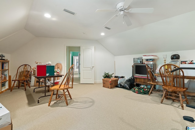 interior space featuring ceiling fan and vaulted ceiling