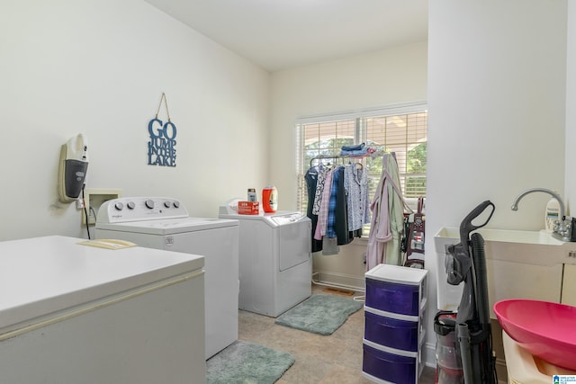 clothes washing area featuring separate washer and dryer