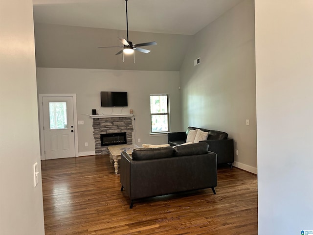 living room featuring a stone fireplace, ceiling fan, high vaulted ceiling, and dark hardwood / wood-style floors