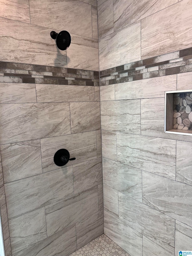 bathroom with tiled shower