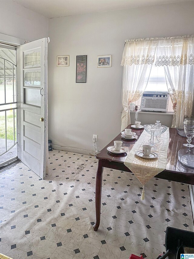 dining area with plenty of natural light and cooling unit