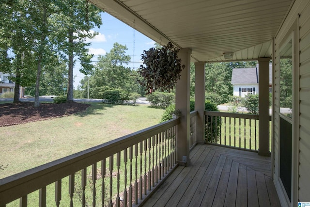 wooden deck with a yard