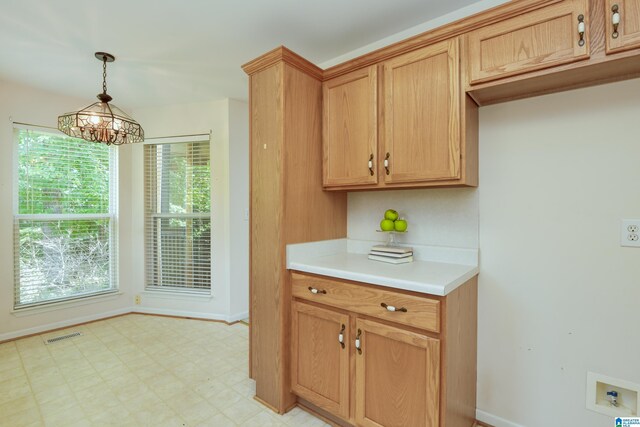 kitchen featuring pendant lighting and light tile patterned floors