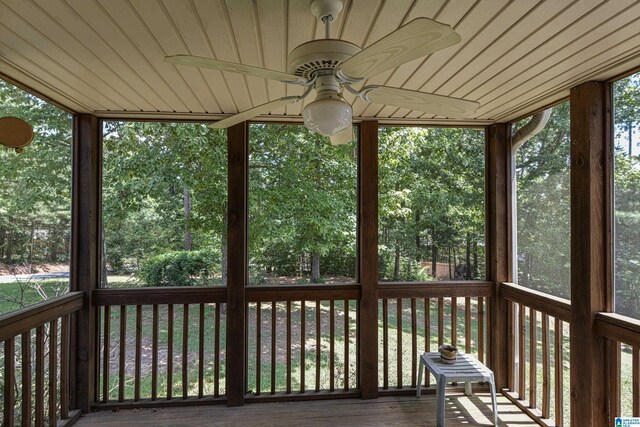 wooden terrace featuring ceiling fan