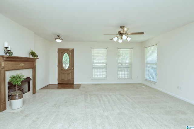 living room featuring light colored carpet and ceiling fan