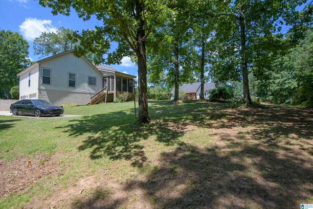 view of yard with a sunroom