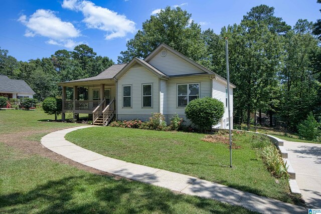 view of front of home featuring a front yard and covered porch