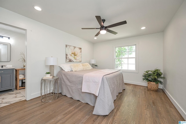 bedroom with ceiling fan and wood-type flooring