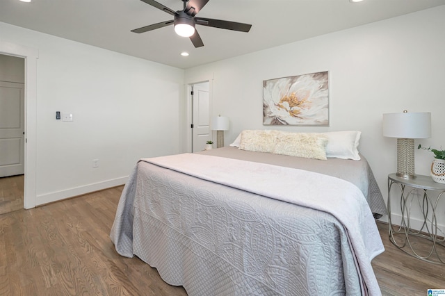 bedroom with ceiling fan and hardwood / wood-style floors