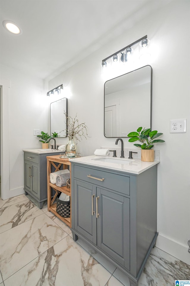 bathroom featuring tile patterned flooring and vanity