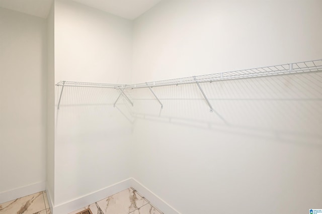 spacious closet featuring tile patterned flooring