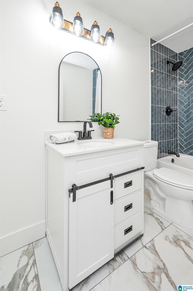 full bathroom with tile patterned flooring, toilet, tiled shower / bath, and vanity