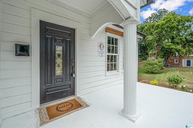 doorway to property featuring covered porch