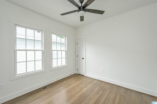 empty room with light hardwood / wood-style floors and ceiling fan