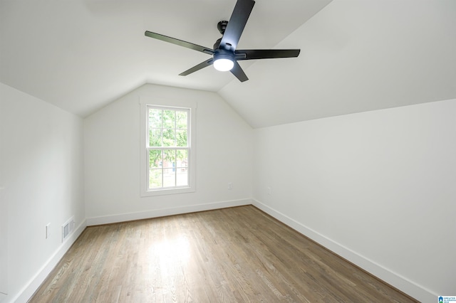 bonus room with light hardwood / wood-style floors, ceiling fan, and lofted ceiling