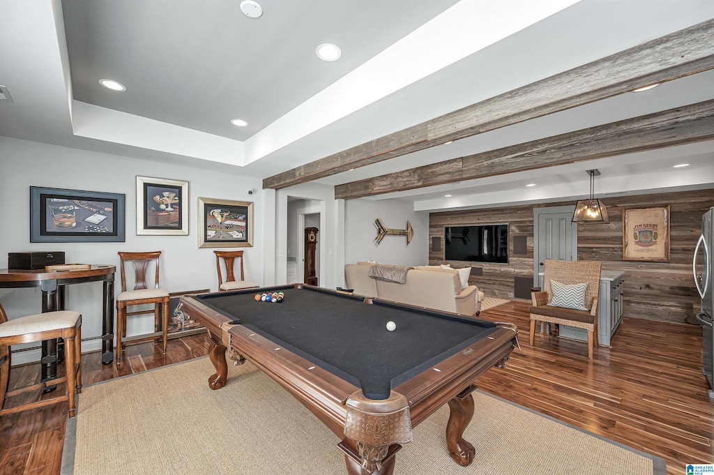 playroom with billiards, dark wood-type flooring, a raised ceiling, and beamed ceiling