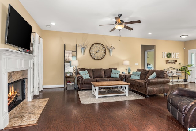 living room with visible vents, wood finished floors, a high end fireplace, recessed lighting, and baseboards