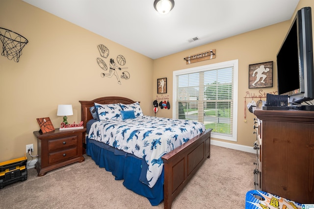 bedroom with light colored carpet, visible vents, and baseboards