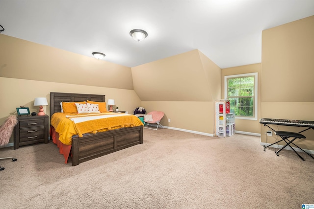 bedroom with baseboards, carpet floors, and vaulted ceiling