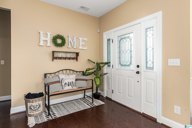 entryway with visible vents, baseboards, and wood finished floors